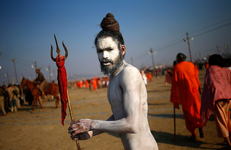 Maha Kumbh : A naked sadhu returns after his ritual dip at Sangam