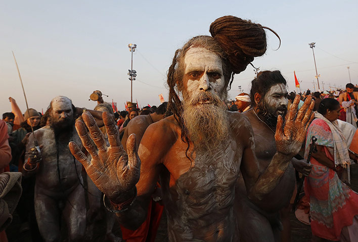 Maha Kumbh : Naked sadhus have their skin painted with ashes for the ritual bath