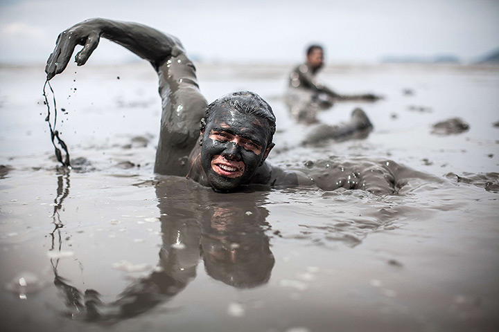 24 hours in pictures: Revelers participate in the traditional Bloco da Lama 