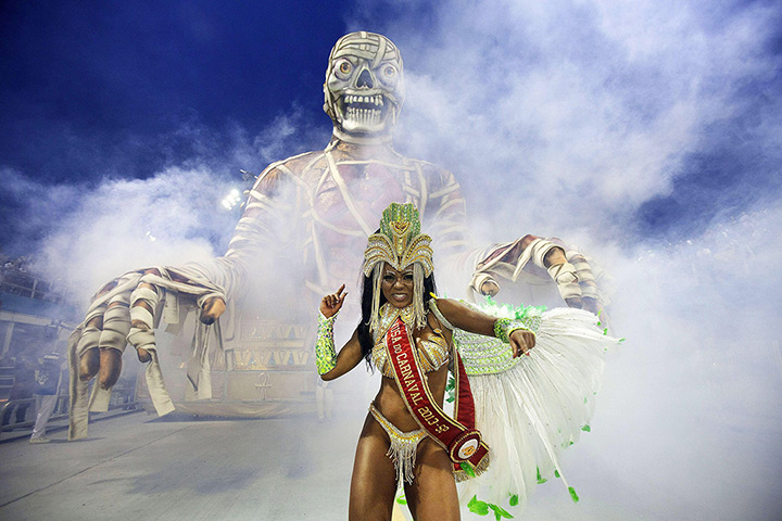24 hours in pictures: A member of the Samba school Grupo Especial 'Imperio da Casa Verde'