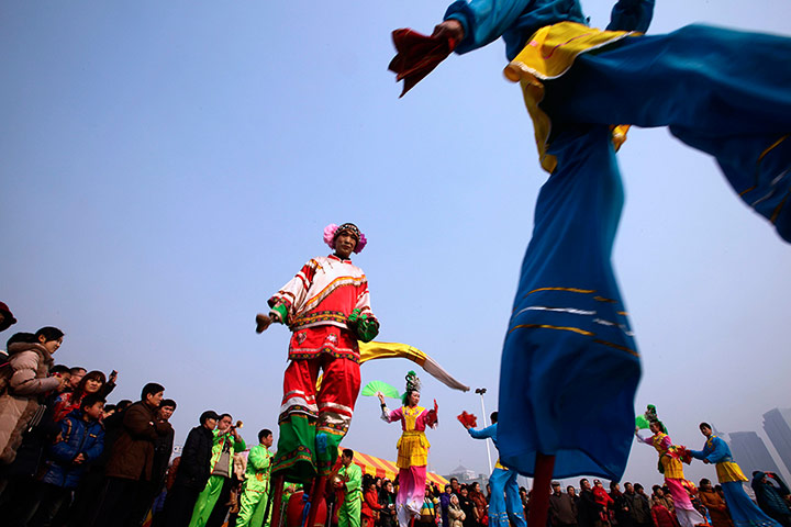 Chinese New Year: Chinese folk artists perform Haicheng stilt dancing in Qingdao
