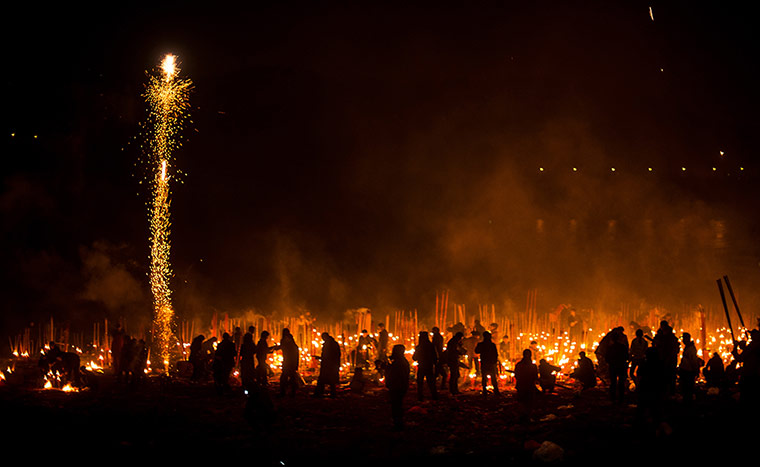Chinese New Year: People light fireworks and burn incense at Dafo Temple in Chongqing, China 