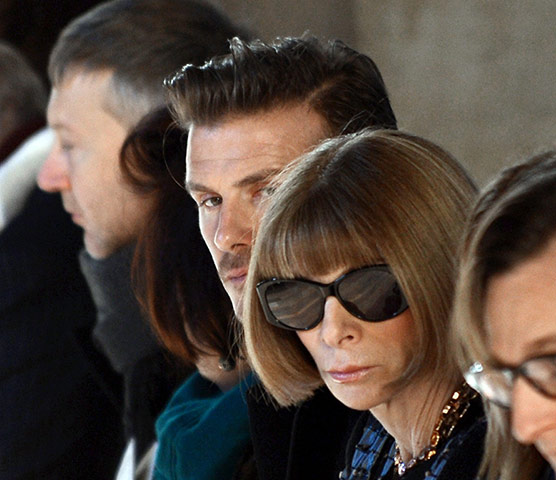 Victoria Beckham: David Beckham sits next to Vogue magazine editor Anna Wintour 