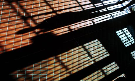 prison bars cast shadow across floor