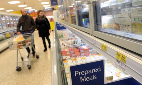 More horsing around: Customers at the frozen prepared meals section at a Tesco's store in London. Tesco's has admitted that some of its Everyday Value Spaghetti Bolognese has contained 60 per cent horse meat, after DNA were carried out.