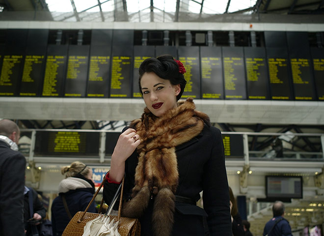 Your Pictures - Glamour: woman dressed in fur against train platform timetable