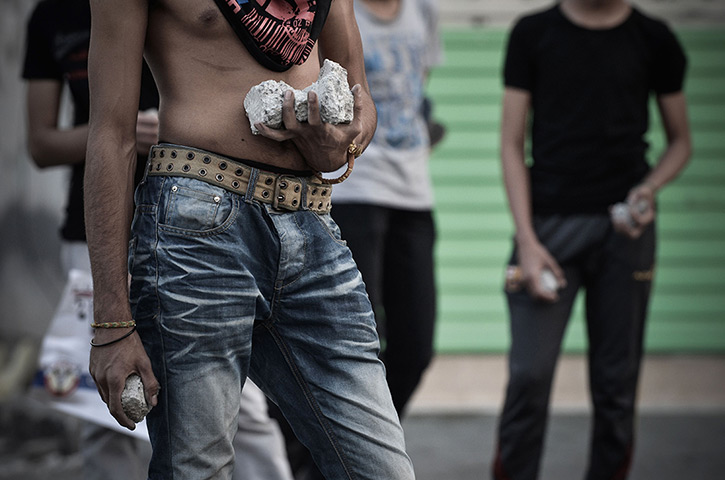 24 hours: Sanabis, Bahrain: Protesters carry stones during clashes