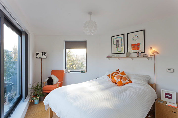 Homes - Lewisham NB: bedroom in a narrow room with glass walled side 