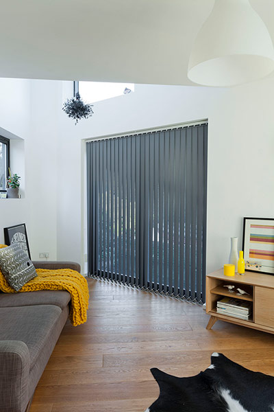 Homes - Lewisham NB: living room in narrow house with wooden floor and white wall