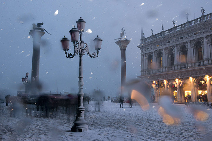 Venice in the snow: Snow falls on St Mark's square during the carnival
