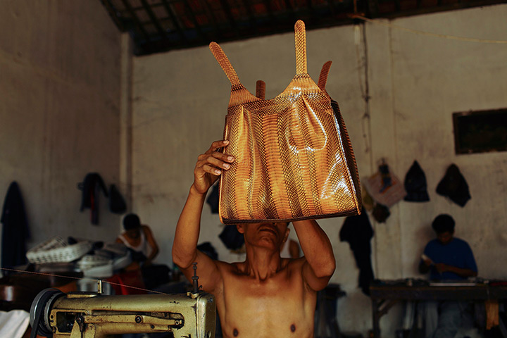 FTA: Beawiharta: A worker looks at a finished bag