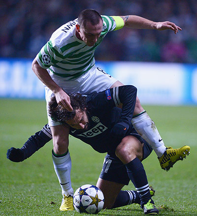 Tuesday Champions League: Scott Brown of Celtic tangles with Andrea Pirlo of Juventus 