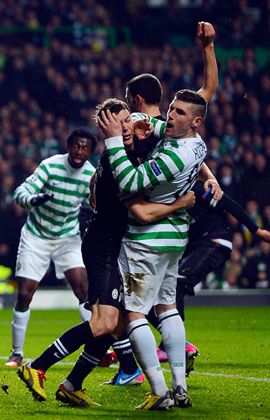 Tuesday Champions League3: Juventus' Stephan Lichtsteiner tussles with Celtic's Gary Hooper 