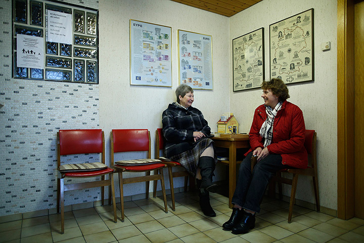 Germany's smallest bank: Two women sit in the waiting room of Germany's smallest bank