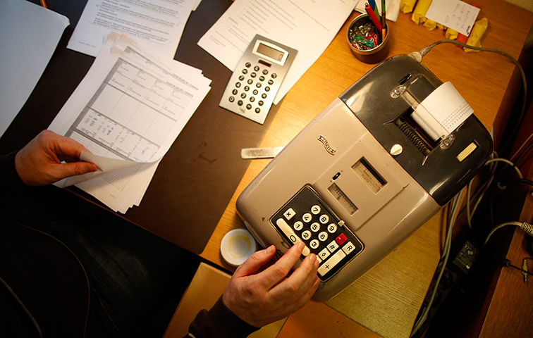 Germany's smallest bank: An old adding-machine at the bank 