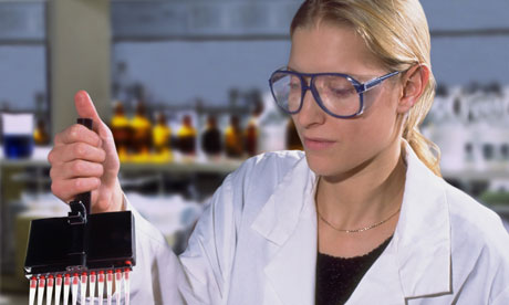 Technician filling test tubes female woman scientist