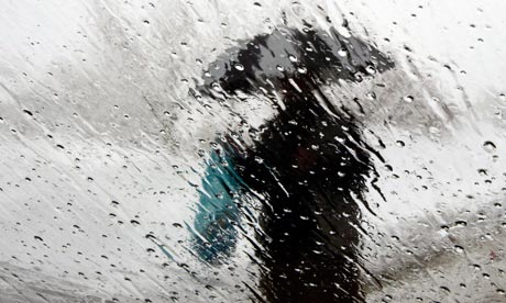 A man with an umbrella in the rain