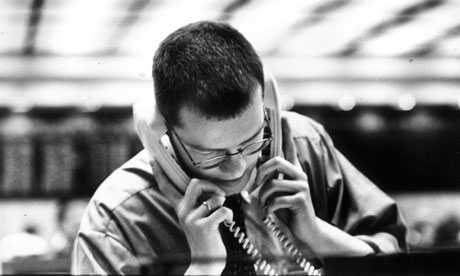 Man on two telephones