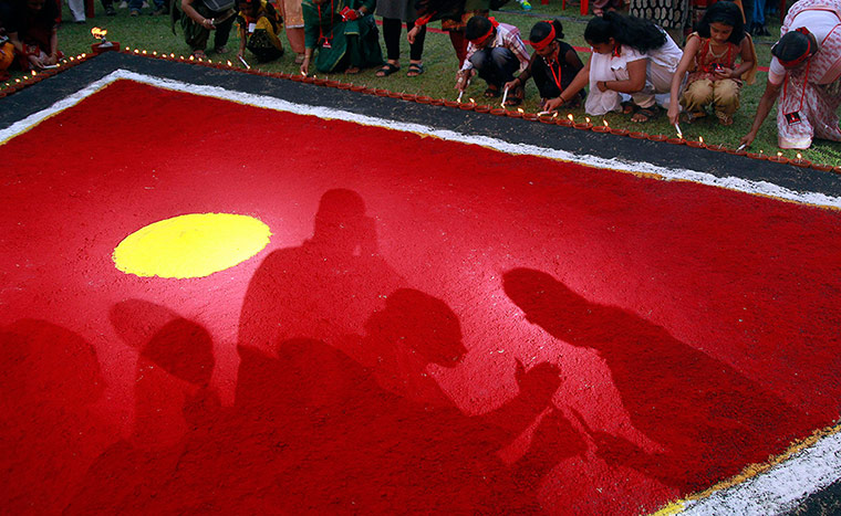 24 Hours: Kochi, India: Participants light earthen oil lamps