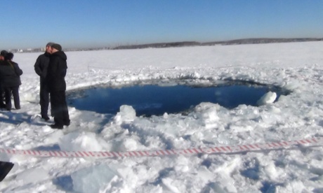 CHELYABINSK REGION, RUSSIA - FEBRUARY 15: A hole in the Chebarkul Lake made by meteor fragments on February 15, 2013 in Chelyabinsk, Russia. A meteor shower hit Russia's Chelyabinsk region today (FRI) injuring around 1000 people.  PHOTOGRAPH BY ITAR-TASS / Barcroft Media  UK Office, London. T +44 845 370 2233 W www.barcroftmedia.com  USA Office, New York City. T +1 212 796 2458 W www.barcroftusa.com  Indian Office, Delhi. T +91 11 4053 2429 W www.barcroftindia.com