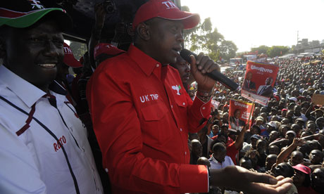 Uhuru Kenyatta (C) and running mate William Ruto address supporters