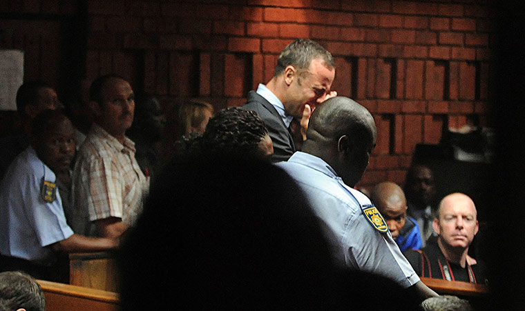 20 Photos: Oscar Pistorius breaks down during his court appearance in Pretoria