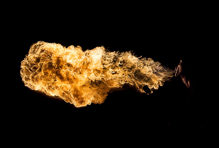 20 Photos: A performer spits fire during a carnival celebration in Madrid, Spain