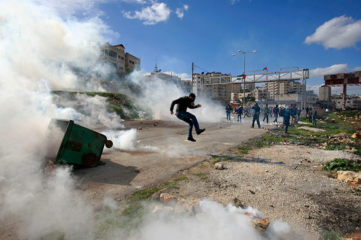 24 Hours: Palestinians during clashes with Israeli troops in Ramallah