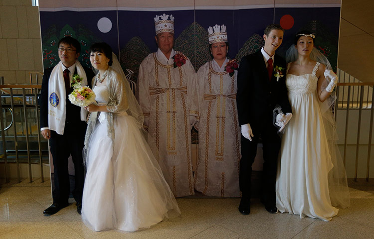 Guardian Camera Club: Couples pose for their wedding photographs against a backdrop