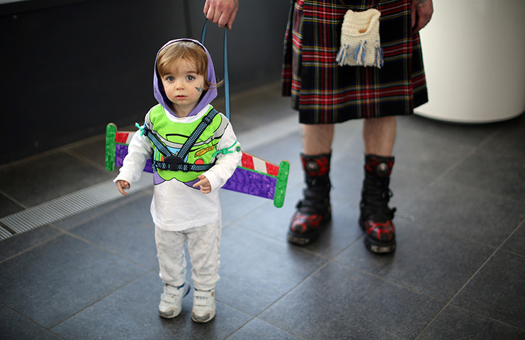 24 hours: Telford, England: Tristan Ellis, aged 3, poses as Buzz Lightyear 