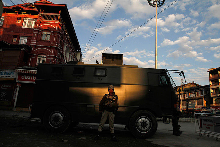 24 hours: Srinagar, India: An Indian paramilitary soldier stands guard 