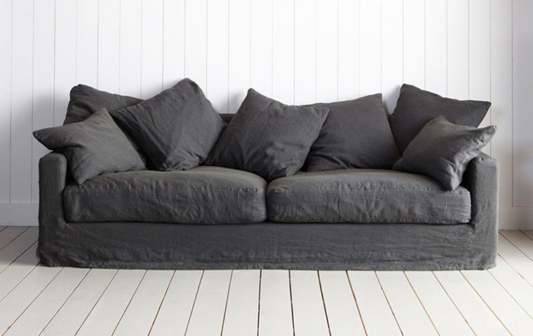 Homes - From Dawn to Dusk: sofa against a white wall with beige floor