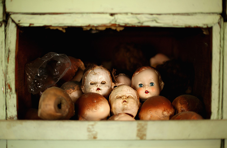 24 hours in pictures: Spare doll heads are seen at Sydney's Original Doll Hospital in Bexley