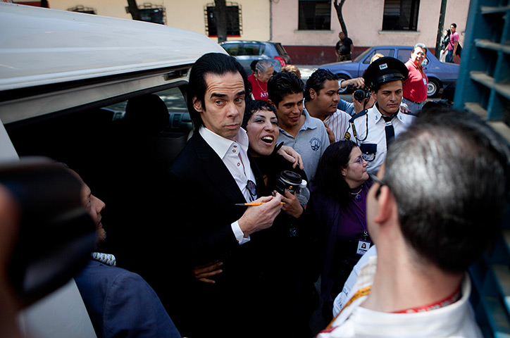 24 hours in pictures: Nick Cave poses with a fans in Mexico