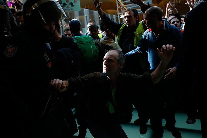 Iberia strike: Day one: An Iberia airline worker reacts as he is pushed away