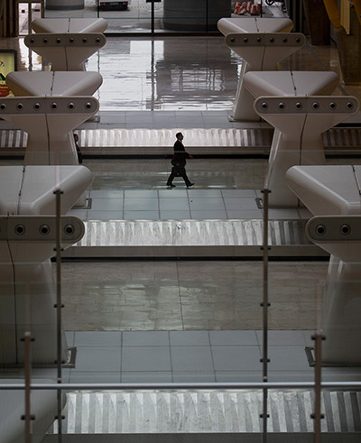 Iberia strike: Day one: A man walks past empty baggage conveyors 