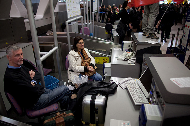 Iberia strike: Day one: British Airways passengers wait inside a check-in point