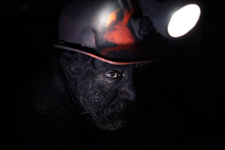 24 hours: A miner takes a short break inside an unregulated coal mine in Sabinas