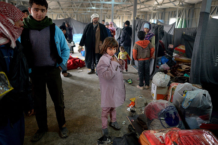 24 hours: A girl stands with bags and blankets