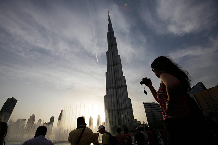 24 hours: Tourists take photographs of Burj Khalifa