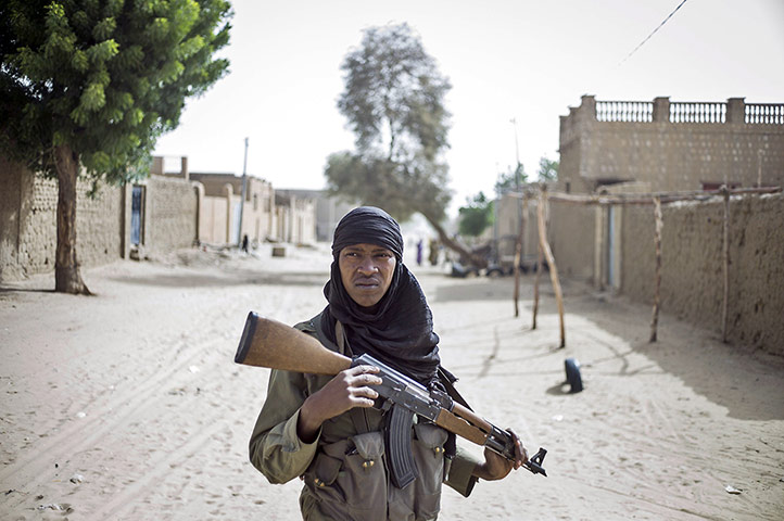 24 hours: A Malian soldier patrols in the streets