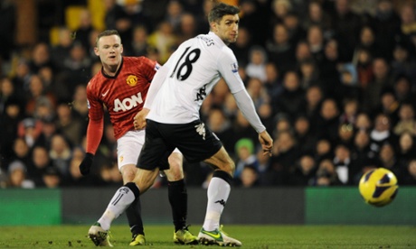 Manchester United's Wayne Rooney and Fulham's Aaron Hughes.