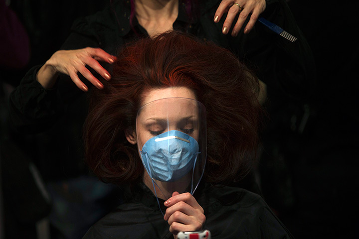 24 hours: Madrid, Spain: A model gets made up backstage 