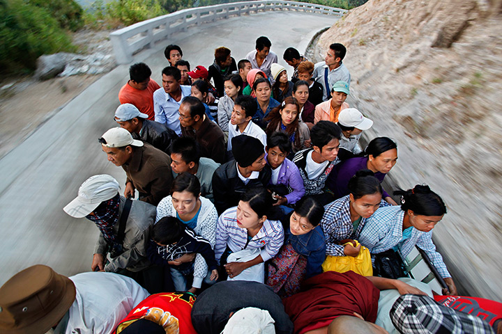24 hours: Burma: People sit on a truck as they travel to Kyite Htee Yoe pagoda