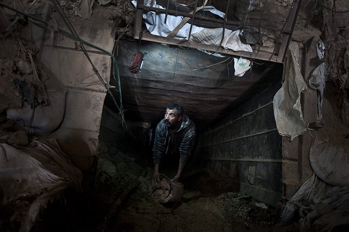 24 hours: Gaza Strip: A Palestinian cleans a smuggling tunnel 