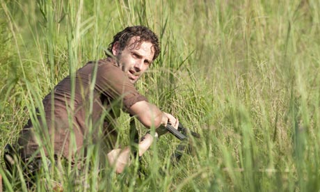 Rick takes cover in The Walking Dead.