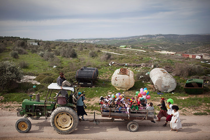 20 Photos: West Bank Settlers Celebrate Purim