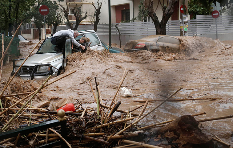 20 Photos: A woman is rescued from flood waters during heavy rain in Athens