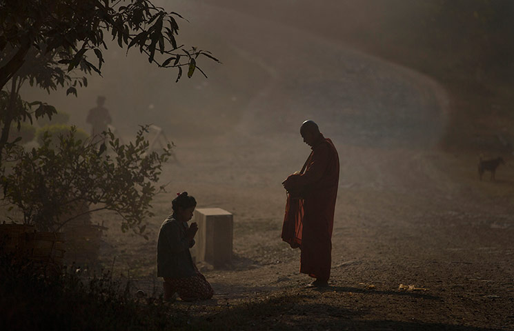 24 hours: A Buddhist devotee prays
