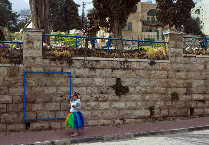 Purim gallery: Jewish settler Purim parade in Hebron